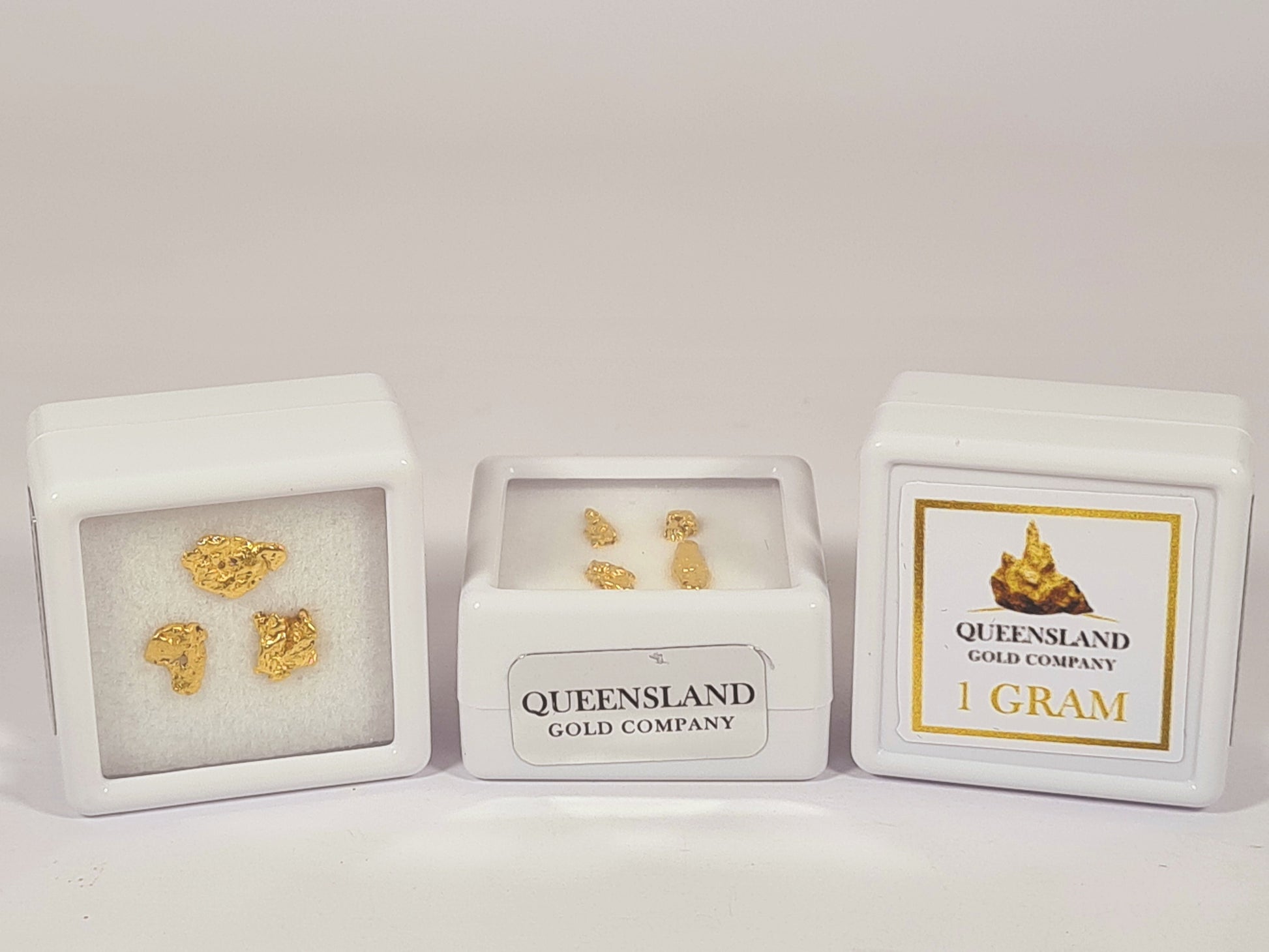 Queensland Gold Company one gram natural gold nugget allocations in branded display cases