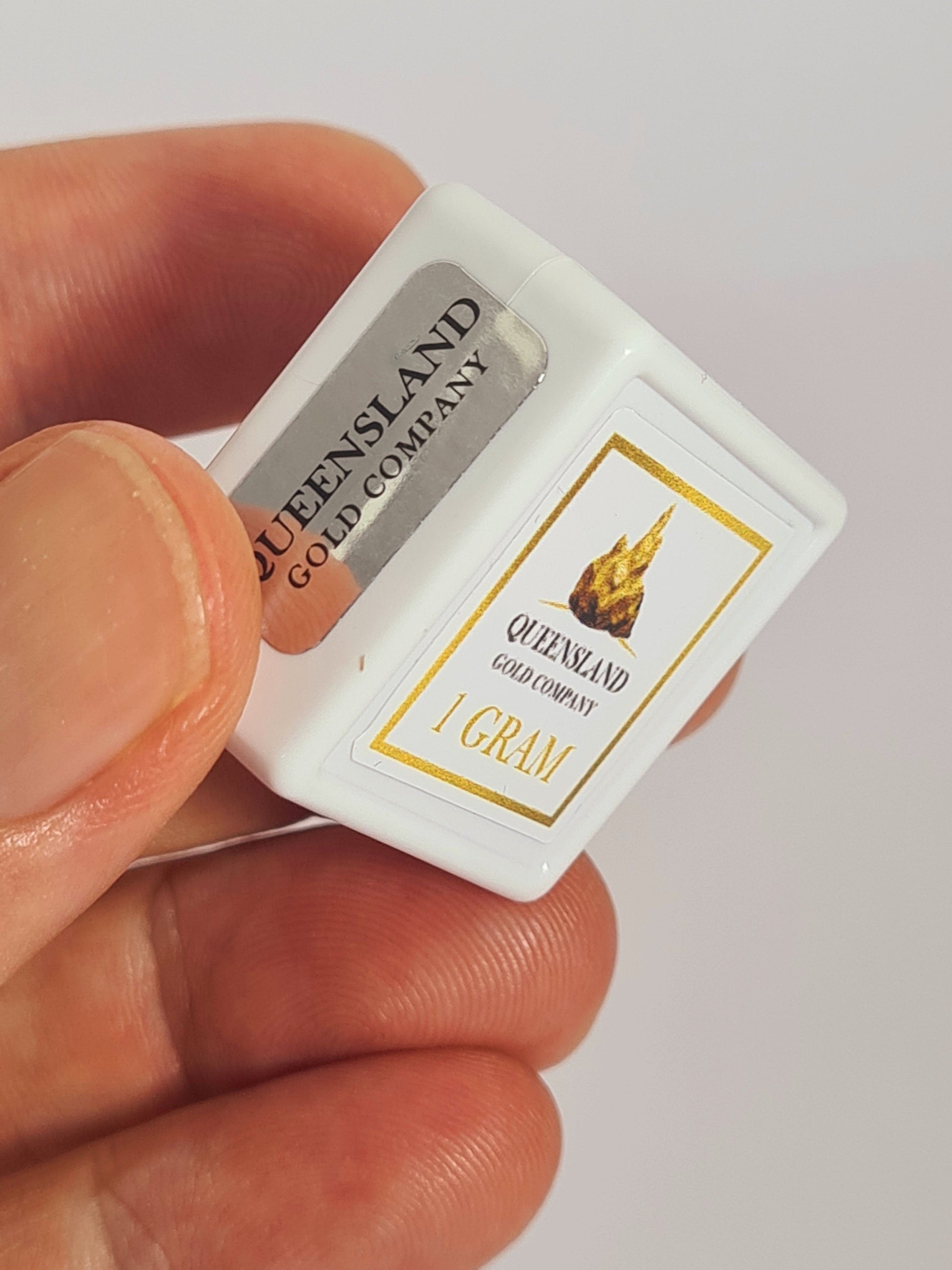 Queensland Gold Company one gram natural gold display case in hand